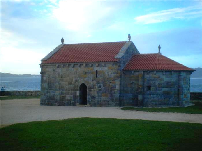 A Lanzada's old stone chapel by Sanxenxo coast.