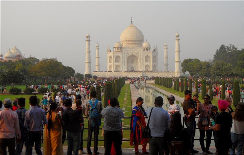 Crowds of people in the gardens on a 1 day visit to Taj Mahal..