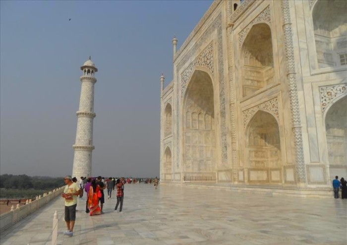 Wide marble promenade behind the Taj Mahal bordering the river.