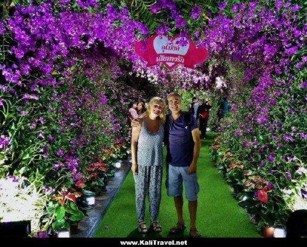 Juan and I under an arch of flowers at the Chiang Rai festival.