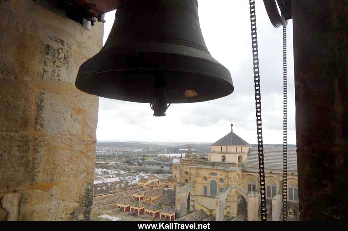 Huge bell in the tower with views to Córdoba mosque-catherdal.
