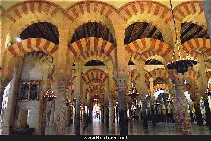 100s of reddish beige striped stone archways inside Córdoba's unique mosque-cathedral.