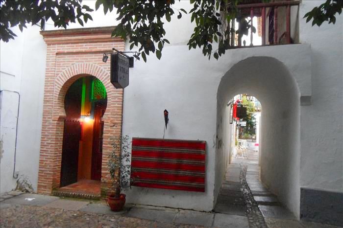 Brick archway and whitewashed passage way in Córdoba historic quarter.