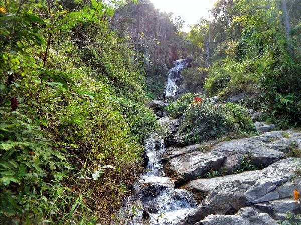 Huay Keaw waterfall flows through foliage on the way to Doi Suthep Temple.