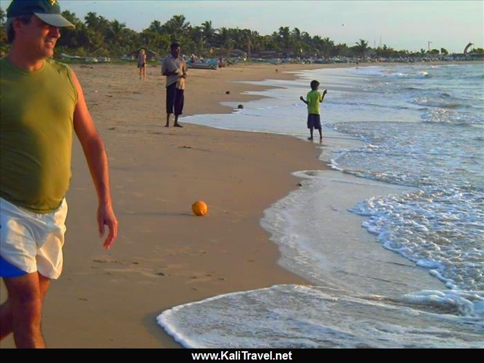 My husband walking on the sands of Negombo beach by the Indian Ocean.