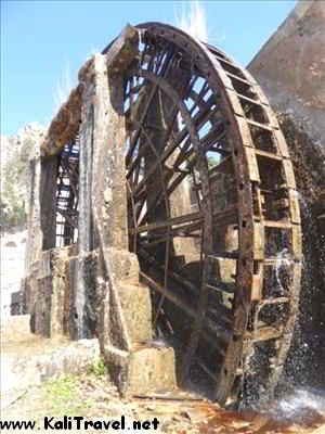 Huge waterwheel in the river.