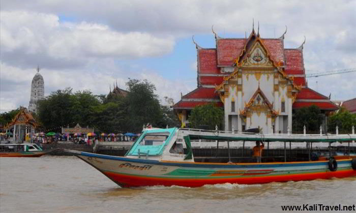 Chao Phraya riverboat passing Wat Rakhang, the Buddhist 'Temple Of Bells'.