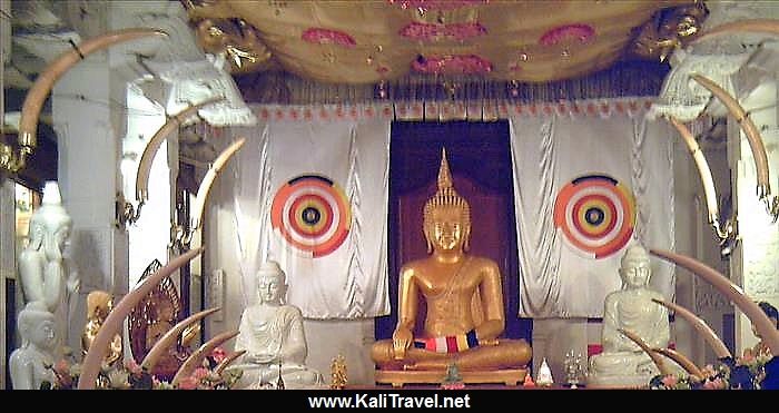 Buddha statues inside the Temple of the Sacred Tooth Relic.