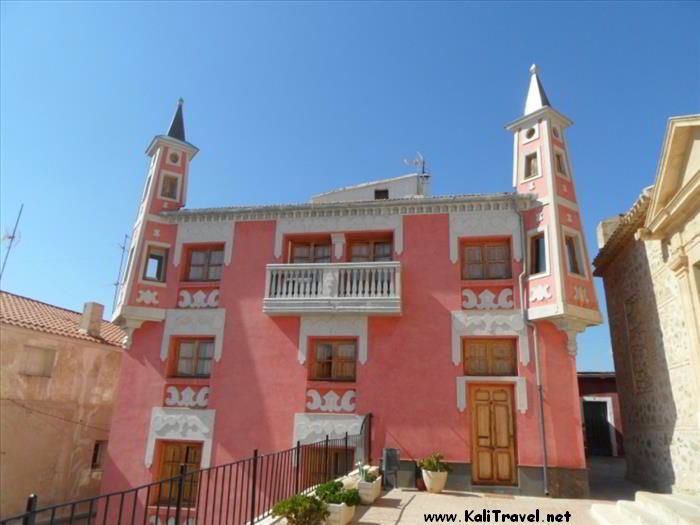 Pink façade and towers of Casa Parisina.