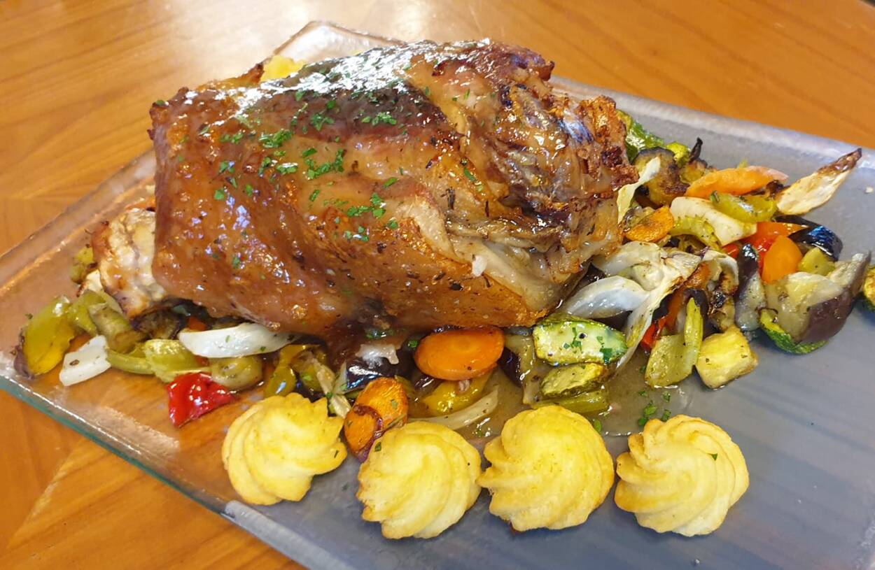 Platter of roast meat and vegetables.