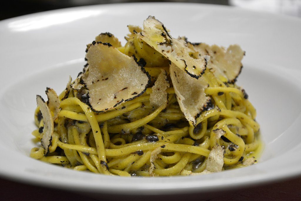 Plate of long, thin tagliolini pasta.