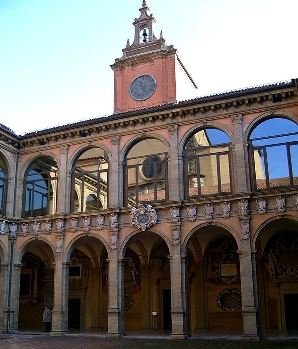 Archways and clocktower, inner courtyard of Archiginnasio Anatomical Theatre in Bologna.