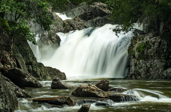 Water cascading over rocks in Cairns in East Australia.