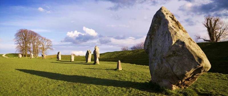 Monolith on grass at Avebury Henge in Wiltshire, England.