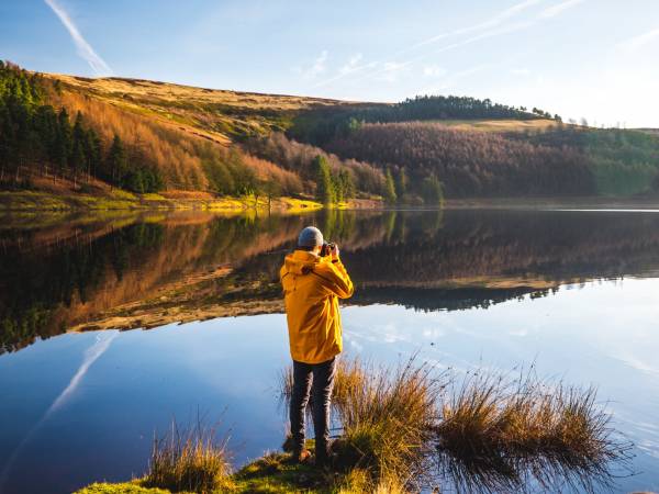 Man by lagoon on the Peak District Monsal Trail.