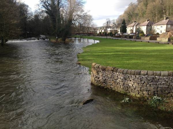 River by village houses in Bakewell, Peak District.