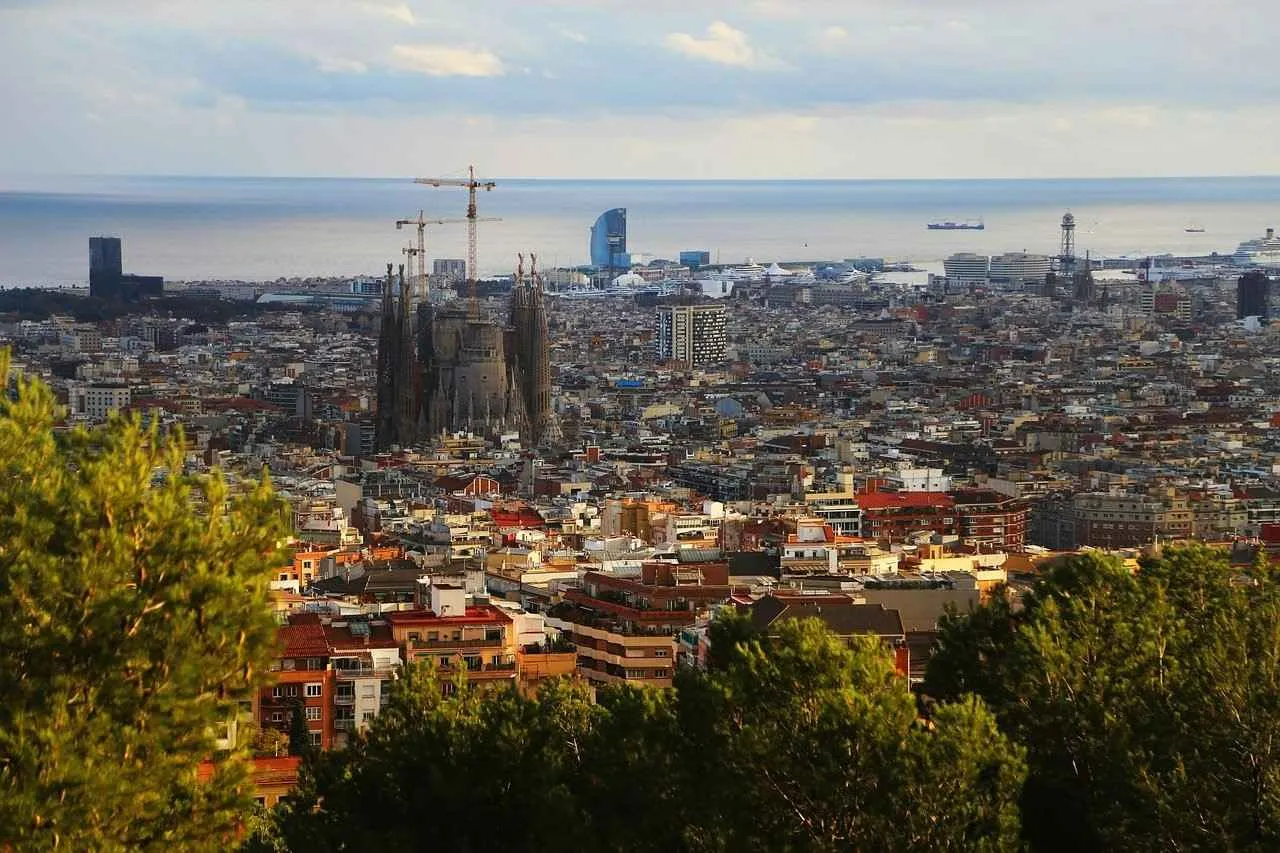 Aerial view of Barcelona cityscape over the old town to the sea.