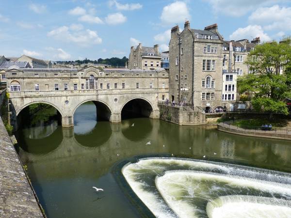 Historic stone bridge over the river in Bath city, England.