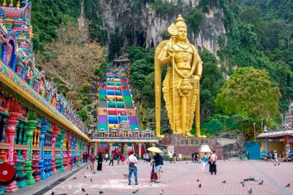 Unique golden statue at entrance to Batu Caves in Malaysia.