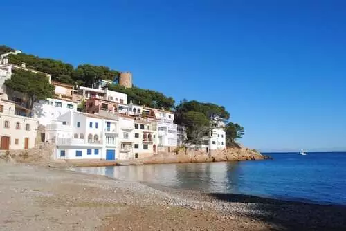 White-washed houses by a beach on the Costa Brava.