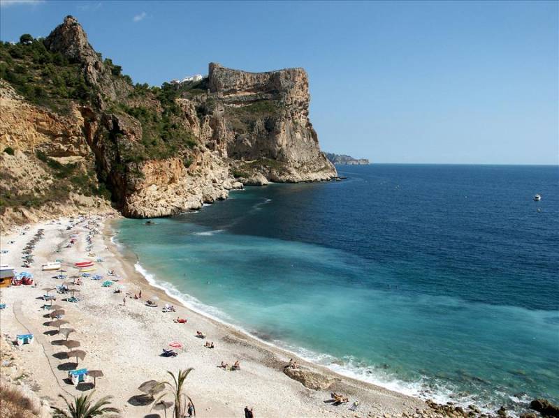 Cala Moraig beach under the cliffs in Benitatxell, Costa Blanca.