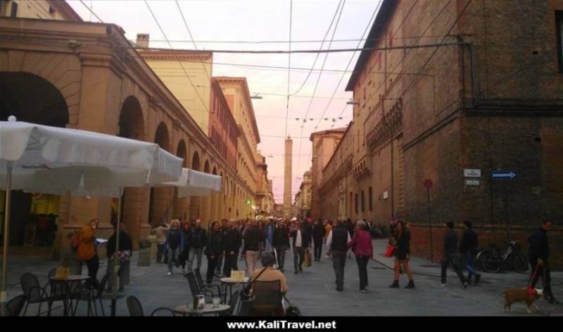 Eating aperitivos in street terraces of  historic Bologna, Italy.