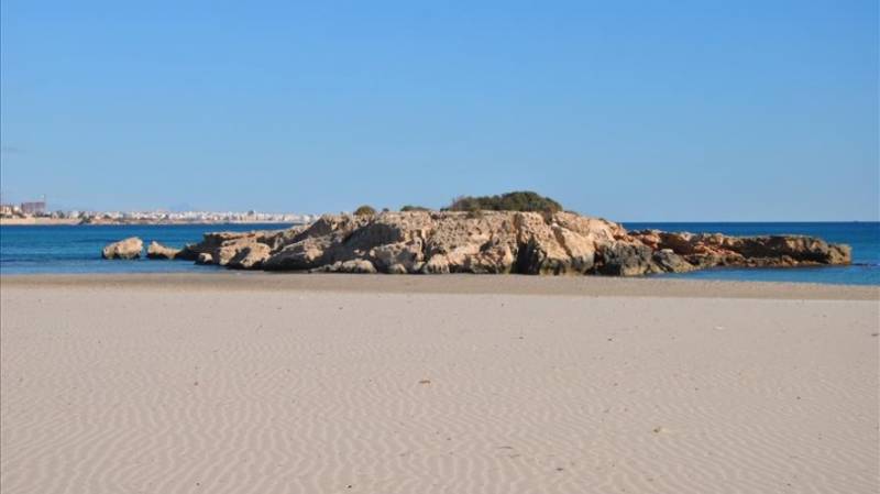 Cala Capitan sands and 'island' in Orihuela Coast, Costa Blanca.