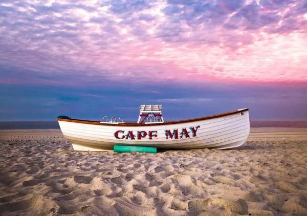 Rowing boat on the sands of Cape May at sunset.