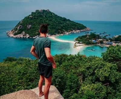 Catalin Geangos looking over the sea to an island in Malaysia.