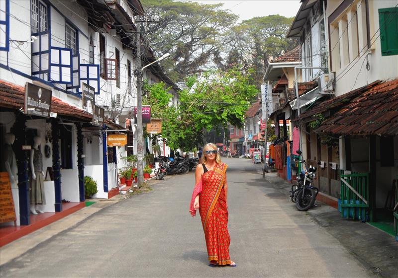 Me Kali in a sari walking through Cochin historic quarter, Kerala.