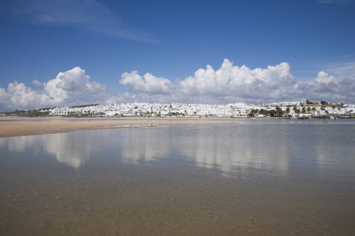 Conil de la Frontera strand and village by the Atlantic ocean in Spain.