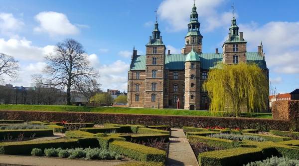 Façade, turrets and garden of Rosenborg castle in Copenhagen, Denmark.