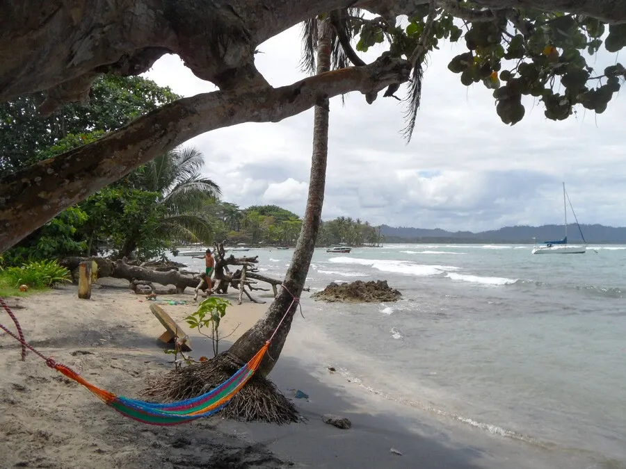 Hammock on Puerto Viejo beach beside the Caribbean Sea.