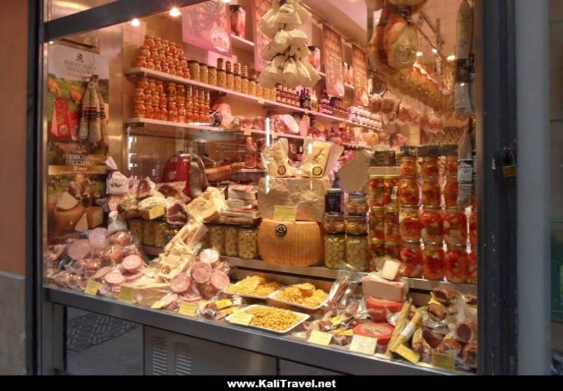 Deli window display of cheese and meats in Quadrilatero, Bologna.