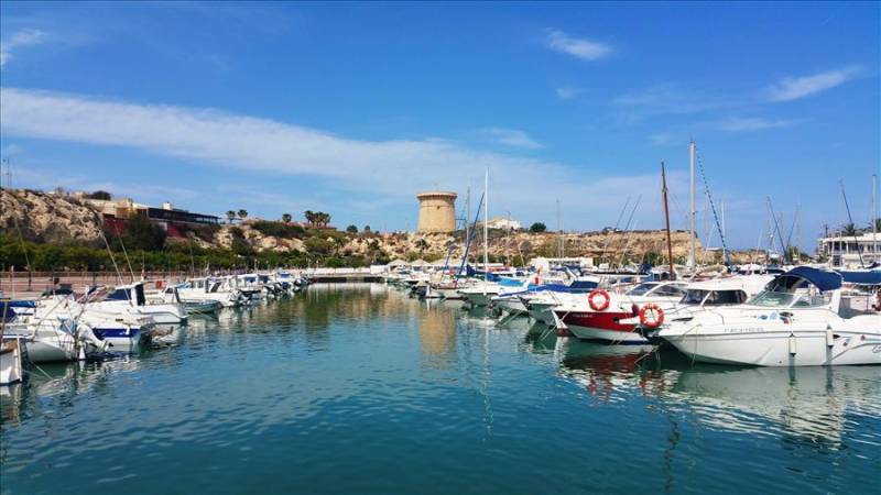 El Campello leisure harbour and Illeta watchtower in Costa Blanca, Spain.