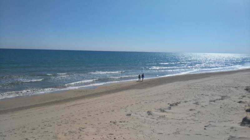 White sands of La Marina Beach beside the sea on theCosta Blanca in Spain.