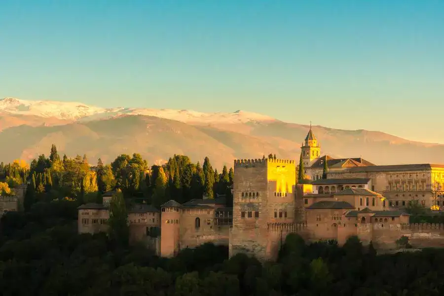 Granada's Alhambra Palace and snow-capped Sierra Nevada in December.