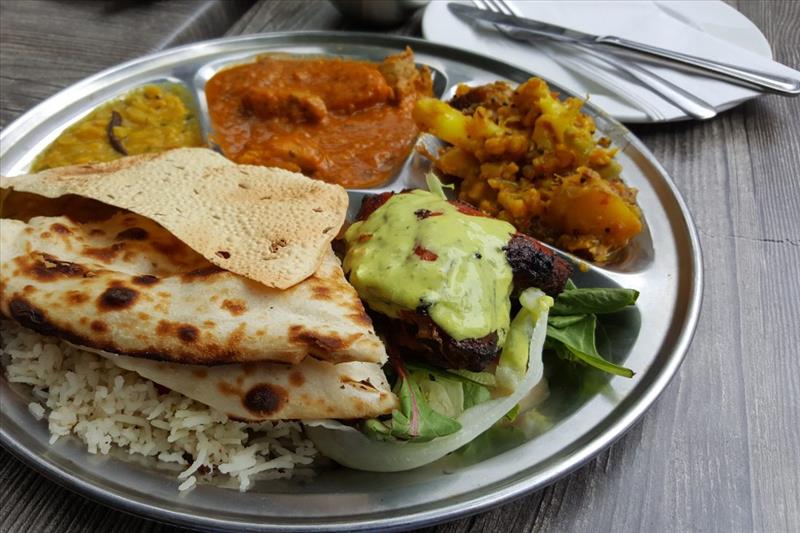 Platter of curries, chutneys and flat bread typical in Kolkata.