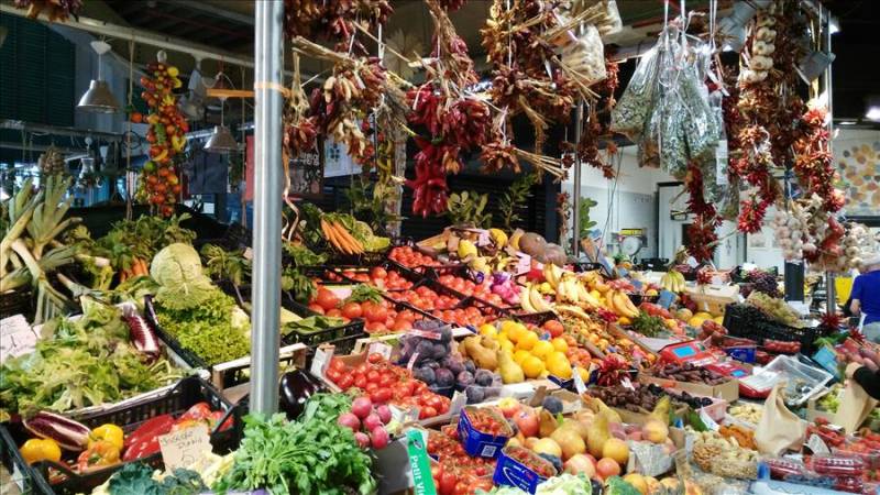 Bologna market stall with fresh vegetables and fruit