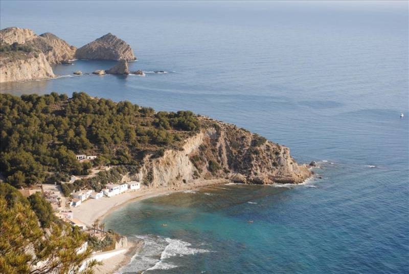 Aerial view of cliffs and Barraca Cove in Javea, Costa Blanca.