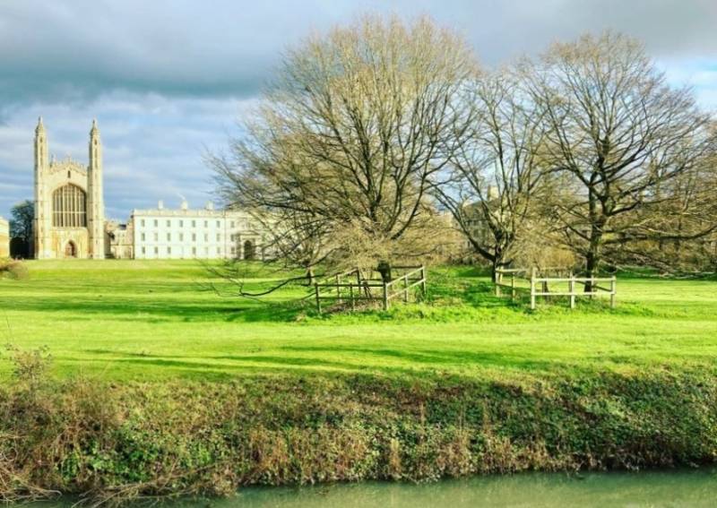 Grassland and trees behind of King's College in Cambridge, UK.