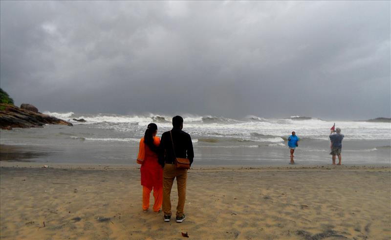 Stormy weather and rough seas at Lighthouse Beach in Kerala.