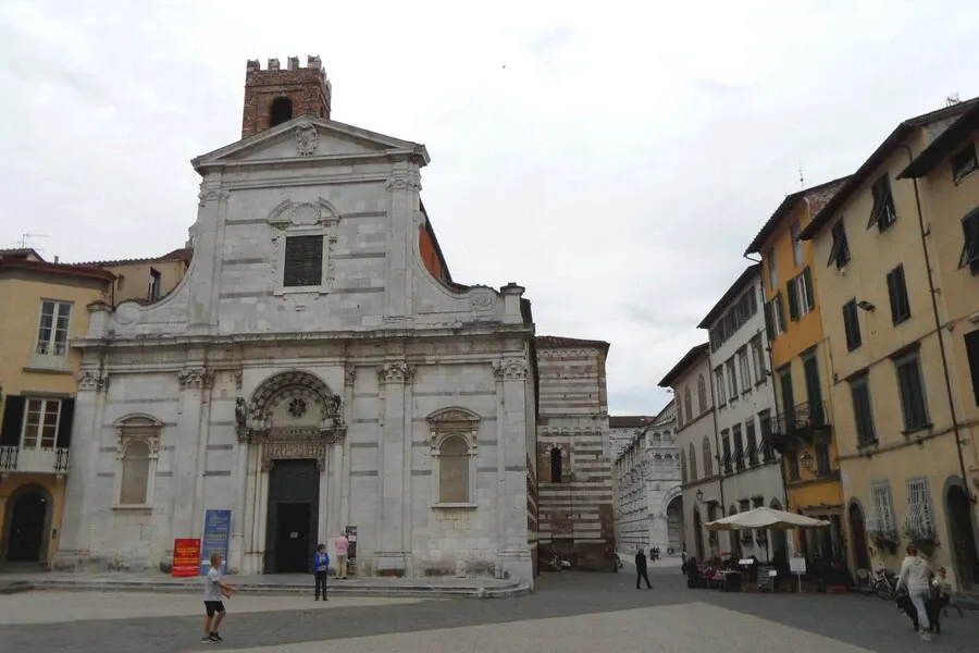 White marble façade and campanile of Saint Reparata church in Lucca.