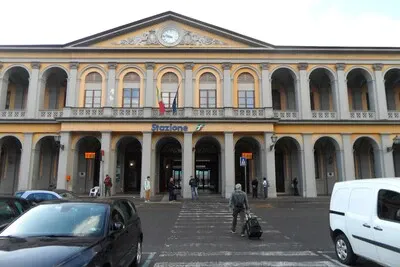 Lucca train station's traditional arched façade.