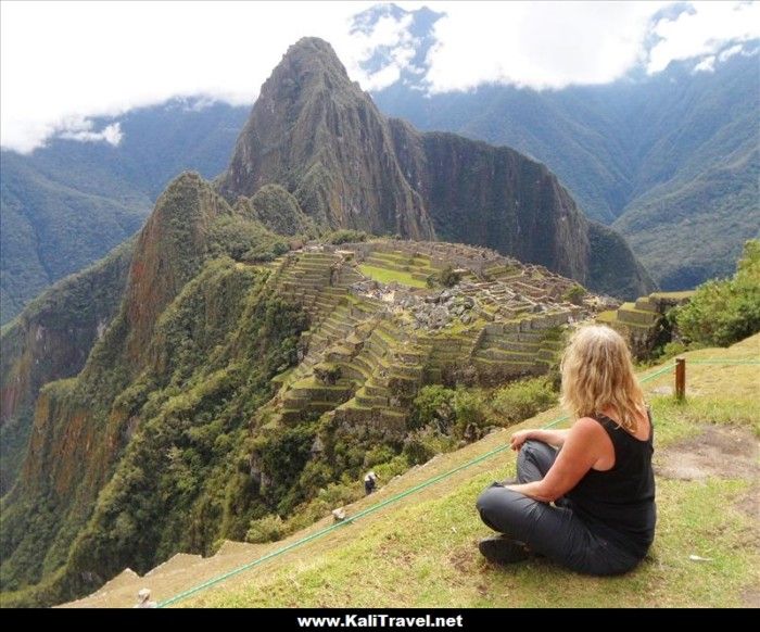 Contemplating Machu Picchu citadel mountain scene.