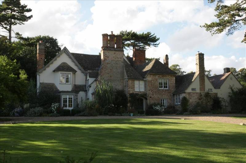 Manor Farmhouse across the lawns in Grantchester village in Cambridge, UK.