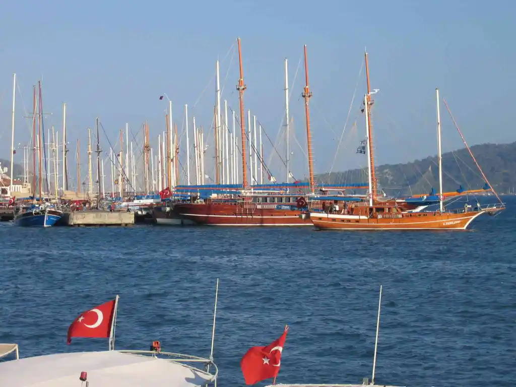 Turquoise sea, Turkish gulet sailing boats more by the quay.