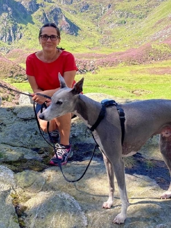 Melanie Varey with her dog in the Cambridge countryside.