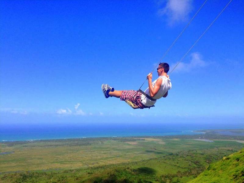 Flying on a swing at Montaña Redonda, Dominican Republic.
