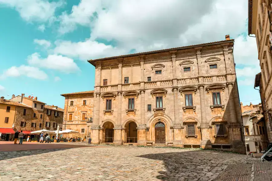 Historical stone palace in cobblestone stone main square in Montepulciano.